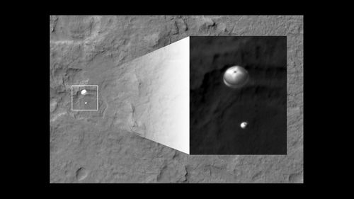 NASA's Curiosity rover and its parachute were spotted by NASA's Mars Reconnaissance Orbiter as Curiosity descended to the surface on Aug. 5 PDT (Aug. 6 EDT). The High-Resolution Imaging Science Experiment (HiRISE) camera captured this image of Curiosity while the orbiter was listening to transmissions from Curiosity. 